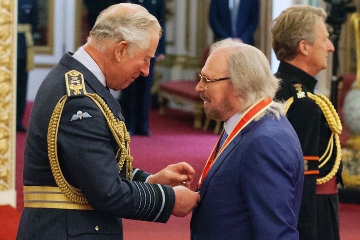 Barry Gibb knighted at Buckingham Palace