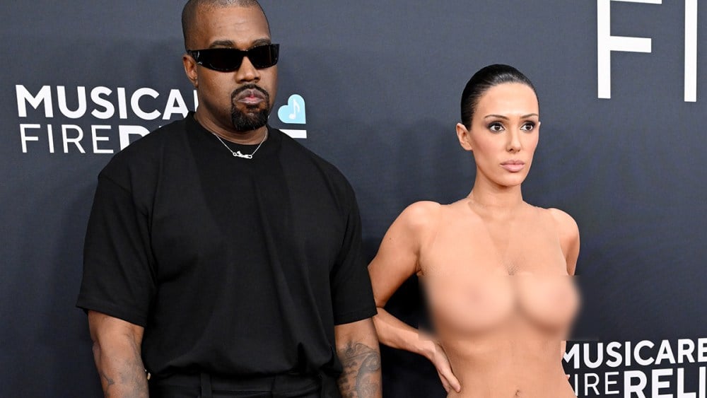 Kanye west has surprise arrival at grammys as wife shocks