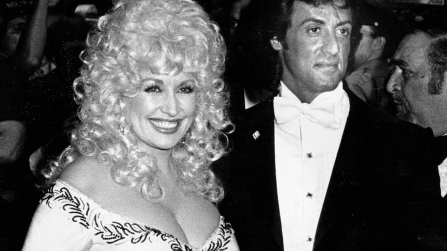 Flashback: Dolly Parton Teaches Sylvester Stallone to Sing