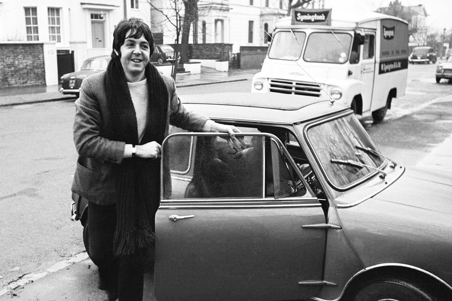 Paul McCartney of The Beatles with his Mini Cooper