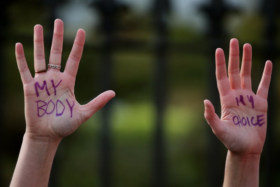 Hands of reproductive rights protester