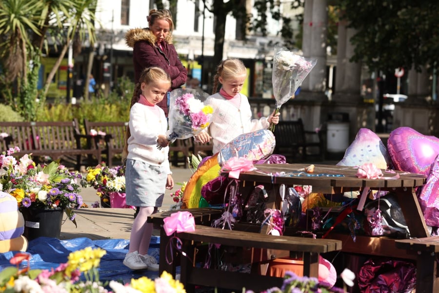 Mourners leave flowers at a tribute for the victims of the Southport stabbing attack