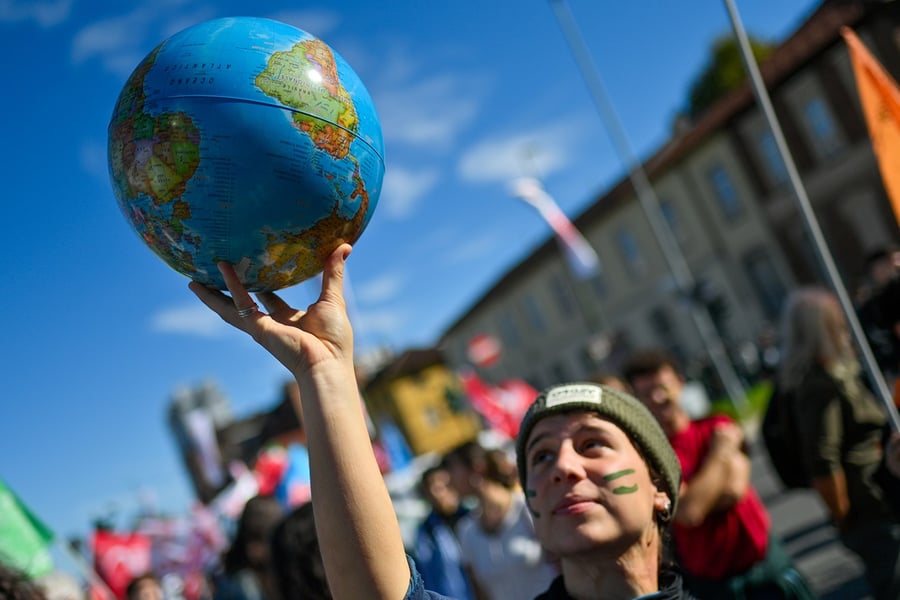 Protesters take part during a Fridays for Future climate protest in Turin, Italy, on Oct. 11, 2024
