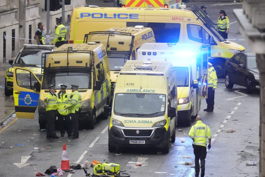 Police and emergency personnel on Water Street in Liverpool after a car collided with pedestrians during the Premier League winners' parade