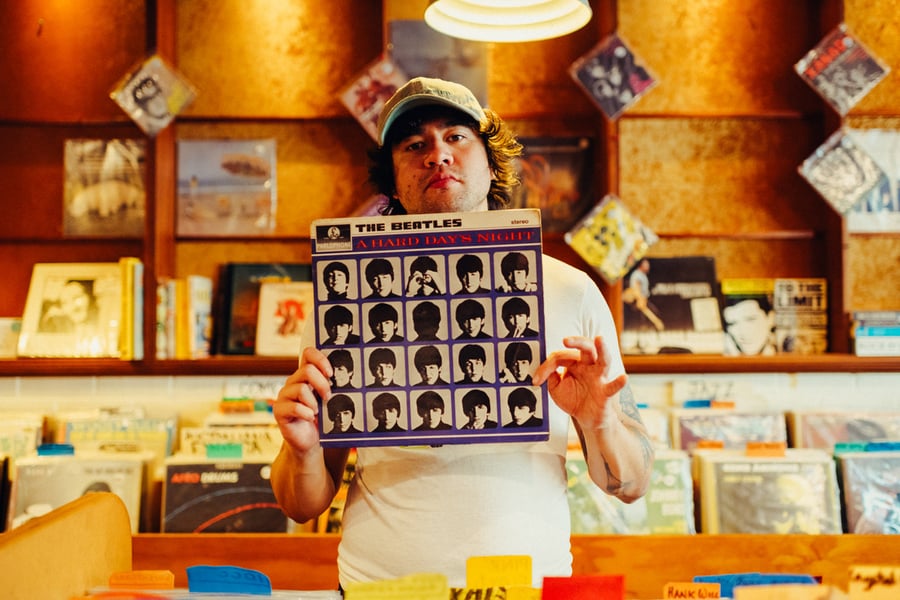 Calum Hood in a record store for Rolling Stone AU/NZ's On the Record series