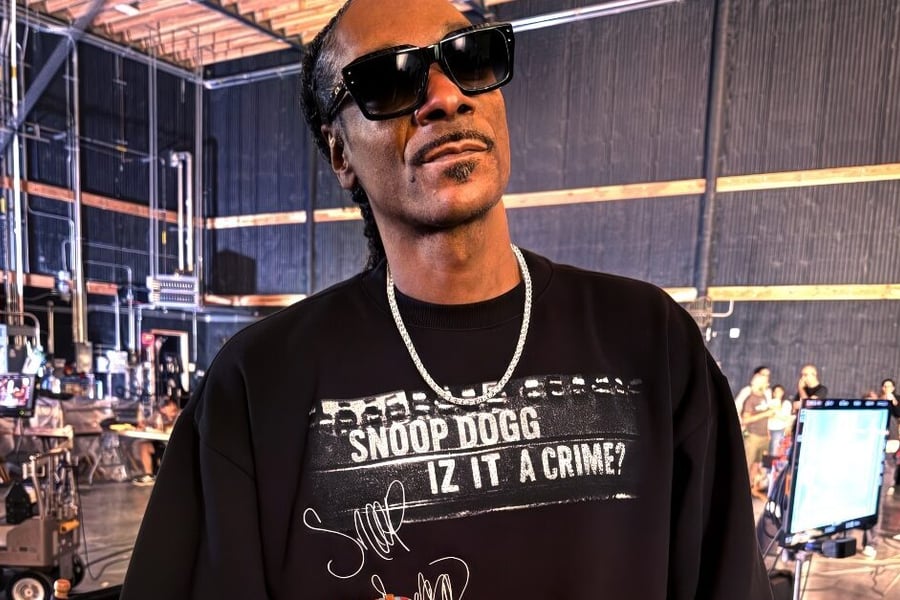 Snoop Dogg holding AFL football