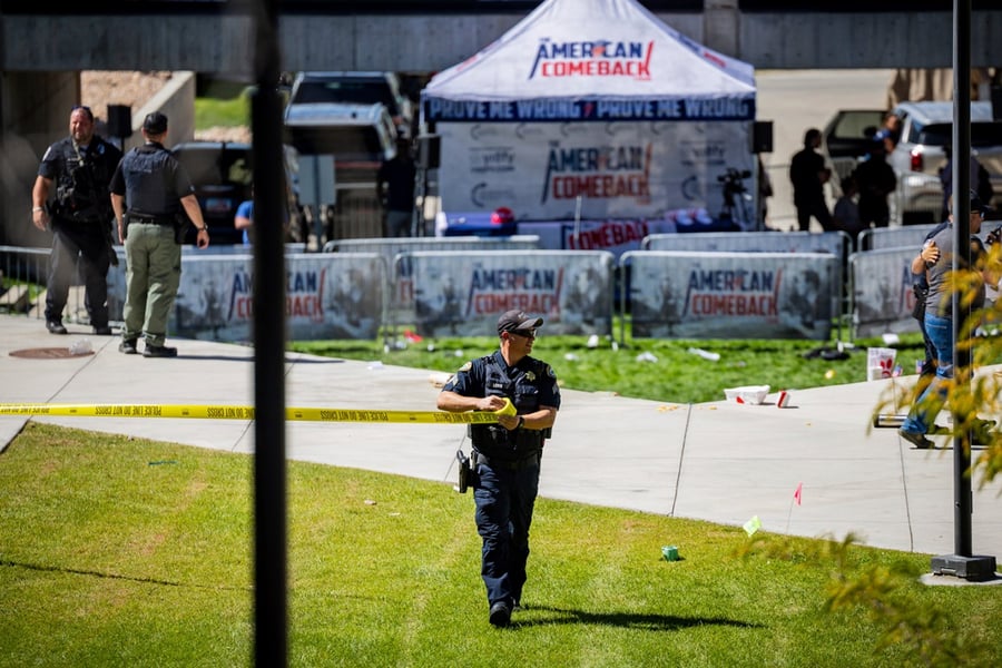Law enforcement tapes off an area after Charlie Kirk was shot at Utah Valley University