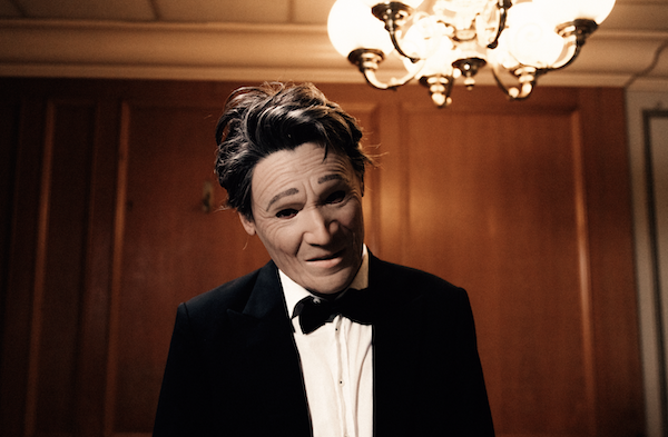 PRESIDENT's masked act posing for the camera