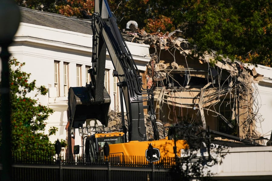 The facade of the East Wing of the White House is demolished by work crews