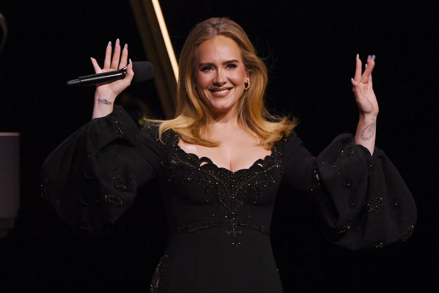 Adele waves at crowd