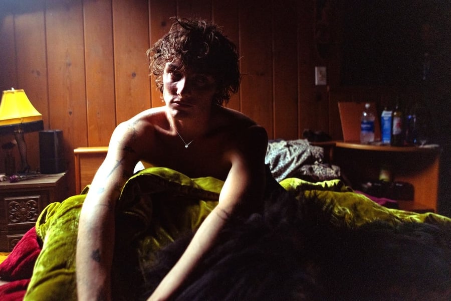 Thomas Day sitting in a bed