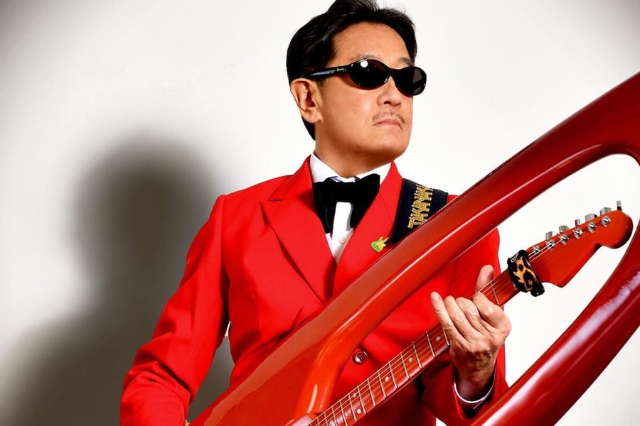 Masayoshi Takanaka with his surfboard guitar