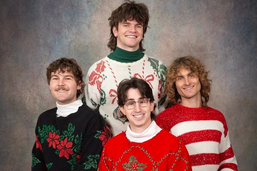 Teenage Dads posing in Christmas sweaters
