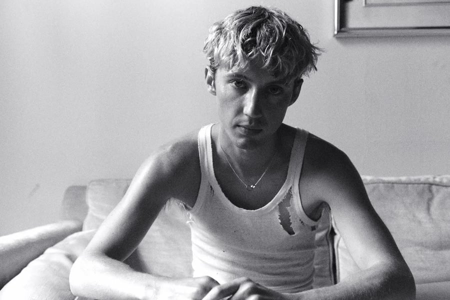 A black and white image of Troye Sivan