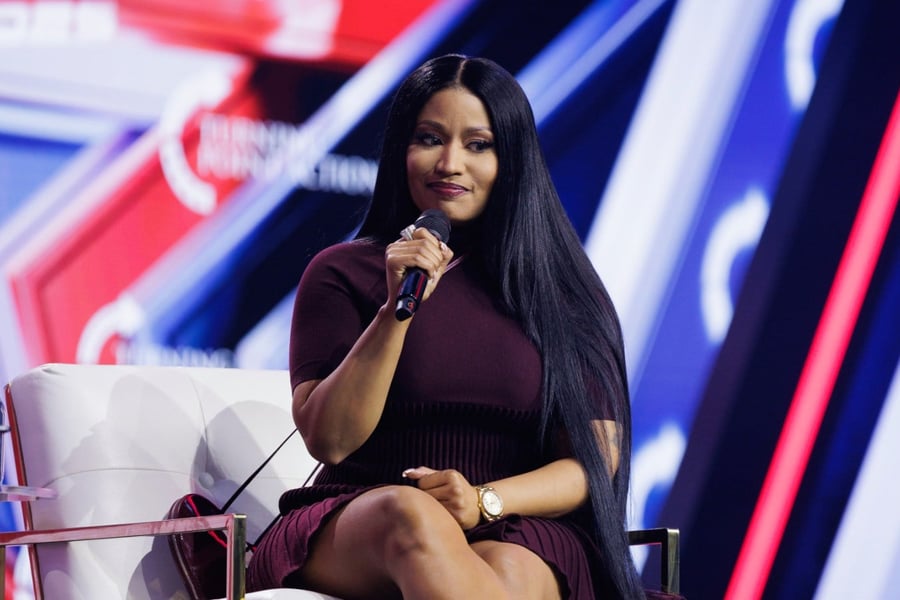 Nicki Minaj speaking at Turning Point USA's 2025 AmericaFest conference in Phoenix.