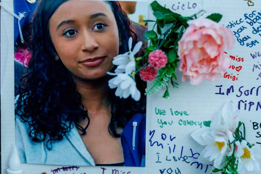 Photographs, notes, and flowers are among the items left at a memorial for Celeste Rivas Hernandez in Lake Elsinore.