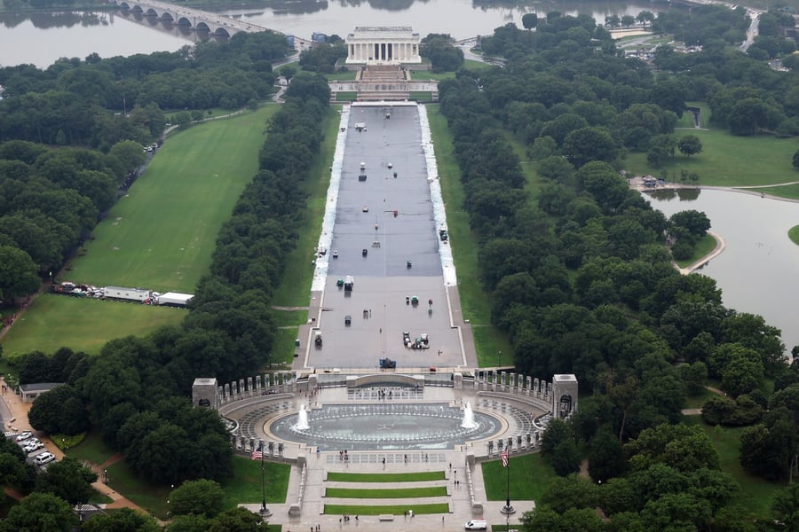 Workers continue to paint the bottom of the Lincoln Memorial Reflecting Pool on the National Mall in Washington, DC