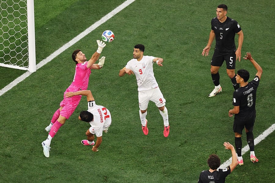 Max Crocombe flaps at a cross against Iran