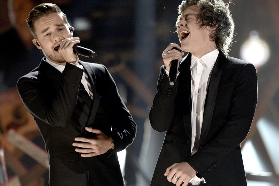 Singers Liam Payne (L) and Harry Styles of One Direction perform onstage during the 2013 American Music Awards at Nokia Theatre L.A. Live on November 24, 2013 in Los Angeles, California.